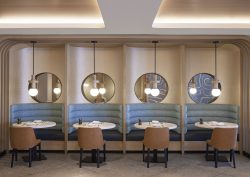 banquette and cubicle with seating and bespoke lighting in the Miami Marriott Biscayne Bay by HBA