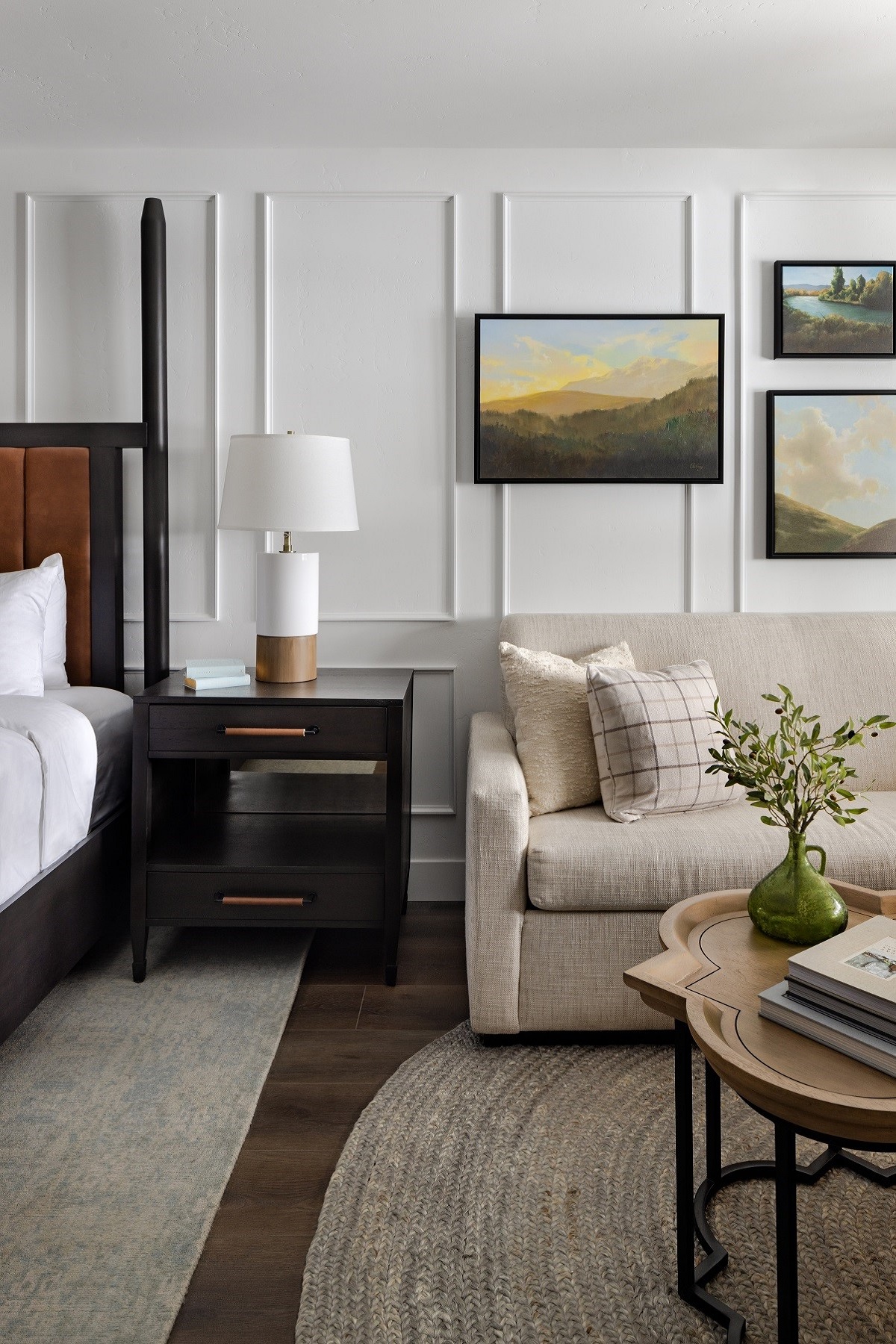 hotel guestroom with couch and gallery wall