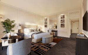 guestroom with wooden floor, patterned rug, round table and seating