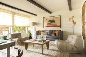 seating in hotel guestroom with carpets, couches and coffee table