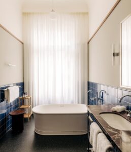 bathroom in chateau Royal with centred freestanding period bath