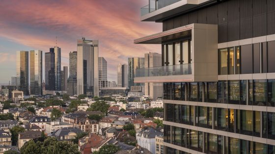 Exterior of Melia Frankfurt City showing corner of balcony and city skyline