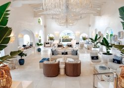 white on white interior lobby with wicker and plants in Windjammer Landing Villa Beach Resort