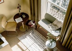 view from above in guestroom at Mason & Fifth London with table and chair and windowseat