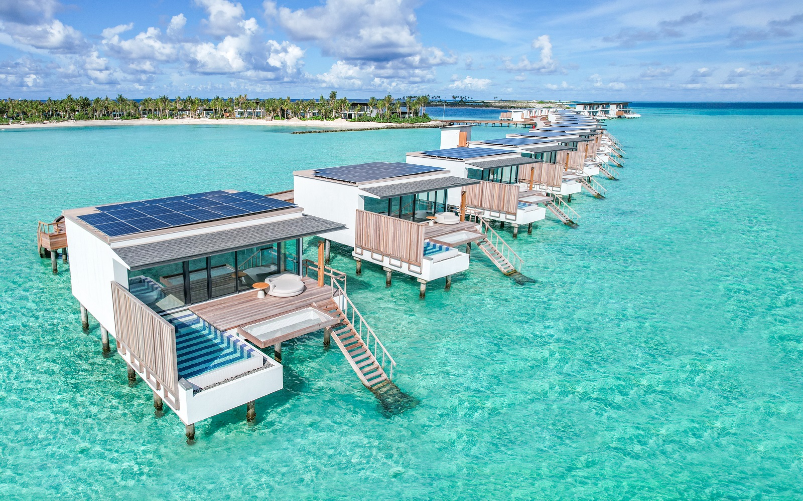 aerial image of SOMaldives over-water bungalows