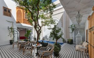 black and white tiled floor and striped cushions in Riad Botanica