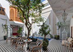 black and white tiled floor and striped cushions in Riad Botanica