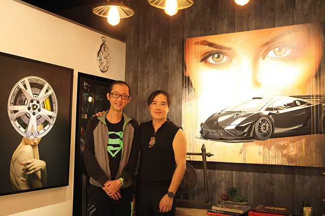 Art Xchange Gallery Director Benny Oentoro posing with Jerry Cheong