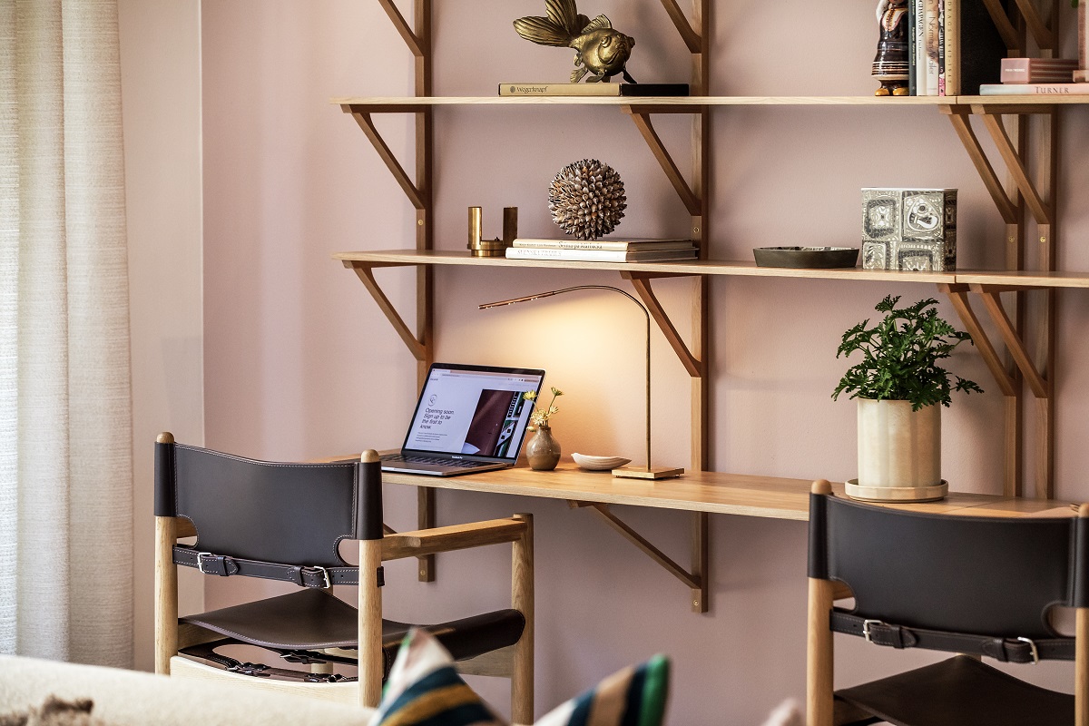 shelving and desk in hotel workspace area