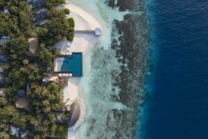 aerial view of buildings and coastline at Huvanfen Fushi Maldives