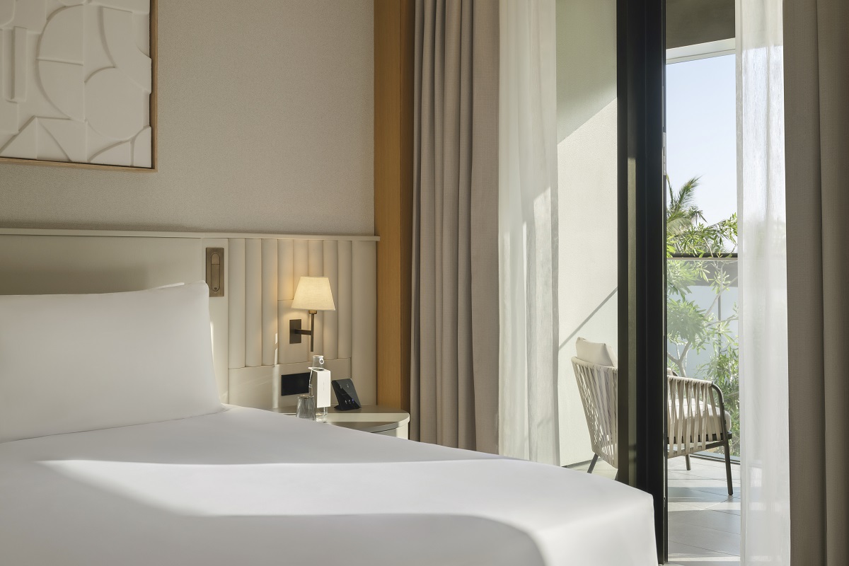 white and cream bedroom at Delano