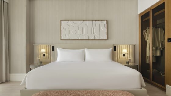 cream surfaces, white bed linen and white art on cream wall in Delano Dubai