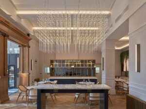 suspended square lighting design by Northern Lights above a table in the entrance to The Municipal