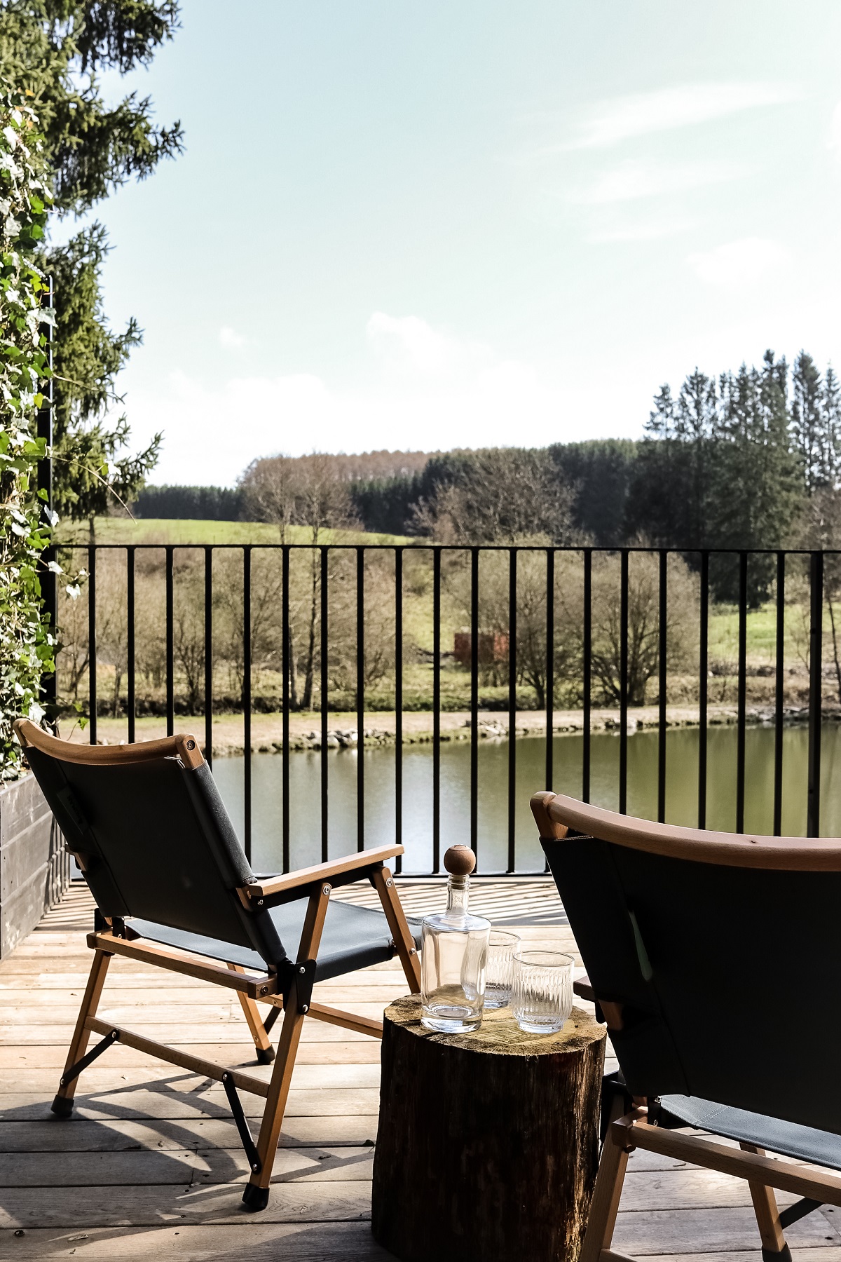 chair and table on outdoor terrace with lake view