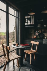 kitchen and dining space in forest lodge with natural materials