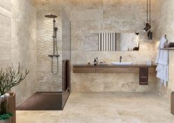 bathroom with natural stone colours and textures in large format tiles on floor and walls from Hyperion Tiles