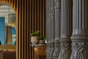 the lobby of JW Marriott Madrid separated by a row of columns