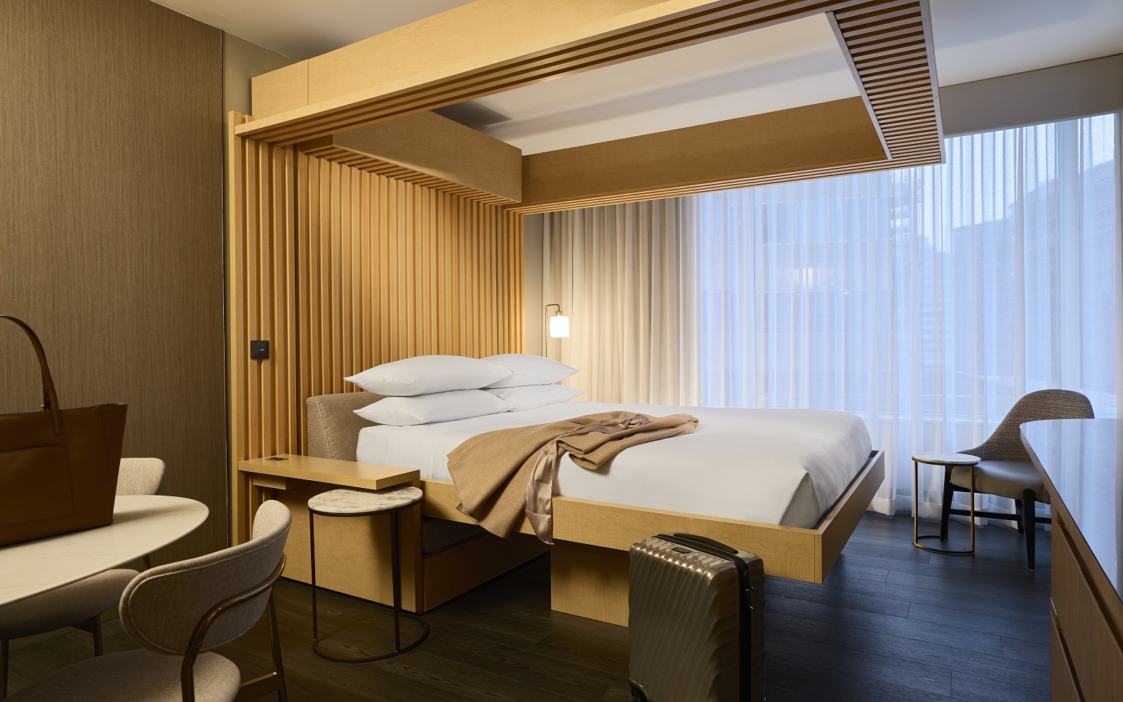 A wooden frame bed in hotel room