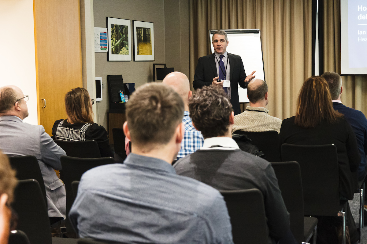 Man speaking at a lecture