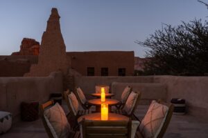 table, chairs and candlelight on the rooftop