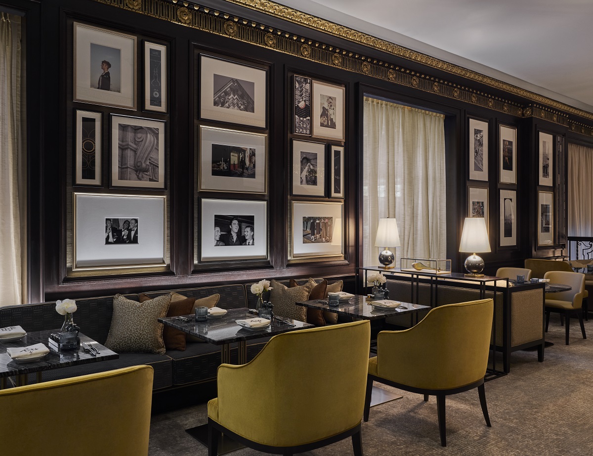 gallery wall and banquette seating in the rosewood hotel georgia 1927 lobby