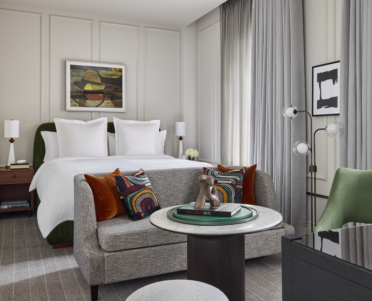 guest suite in neutral tones of grey with accent colours in art and textiles