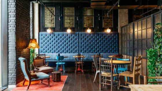 blue banquette and eclectic wooden chairs in Ruby Molly Dublin