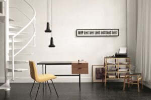 Tanis desk next to spiral staircase in minimalist loft interior