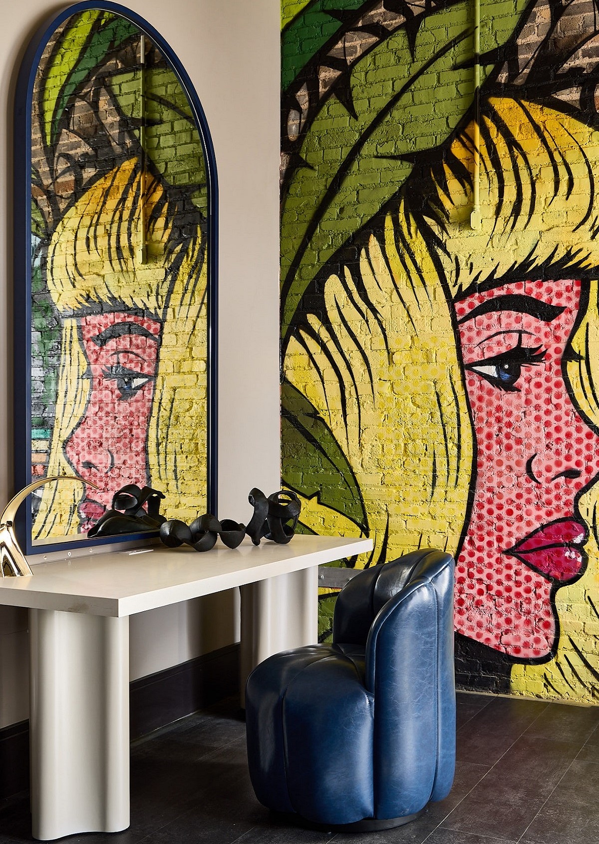 grafitti of girls pop art style face behind vanity in hotel guestroom