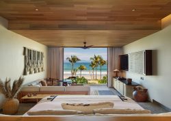 Punta de Mita Wow suite with view from bed out onto palm trees and beach